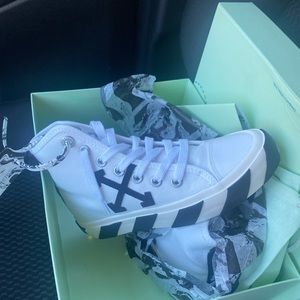 Off-White Vulcanized Mid-Top Sneakers brand new with tags in box and papers.